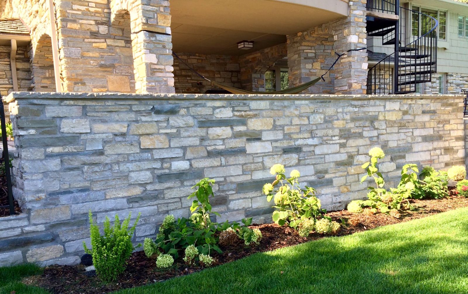 Stone walkway and garden beds